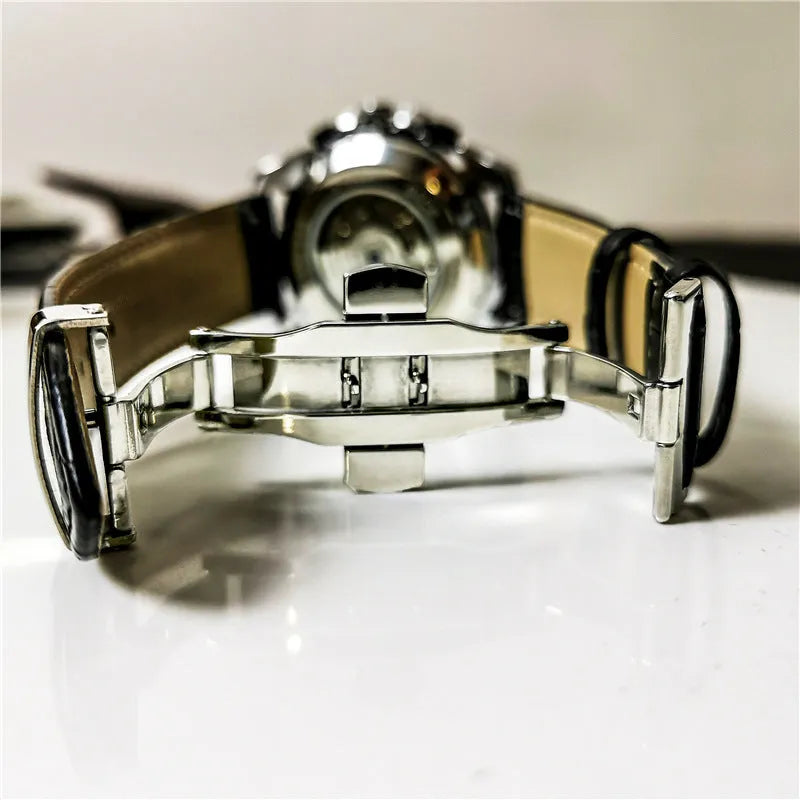 Men's automatic mechanical watch with stainless steel case on wrist, showing multi-functional dial.