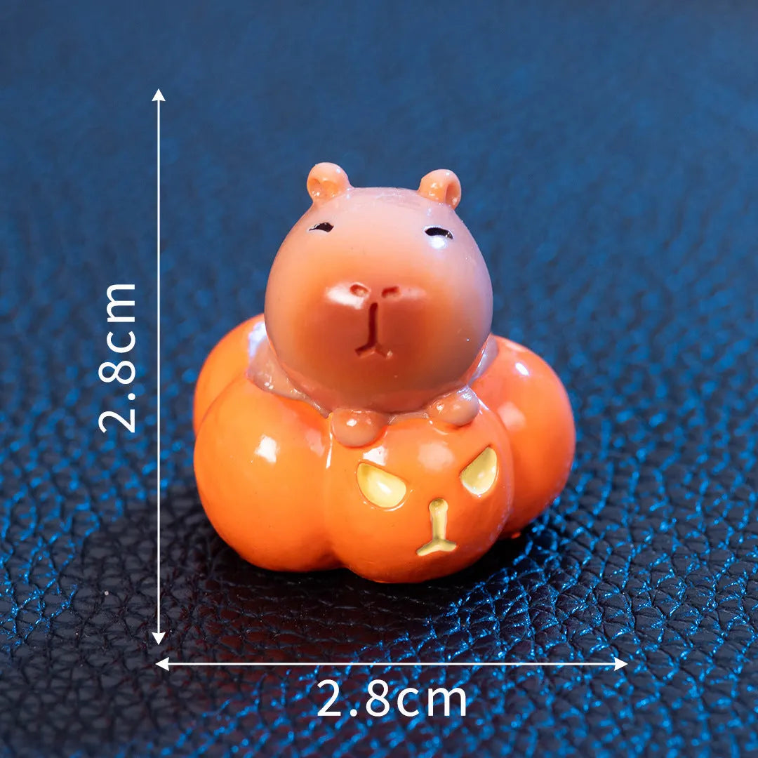Eight Halloween capybara resin decorations showing pumpkin, zombie, ghost, mummy, vampire, witch hat, devil, and skull designs