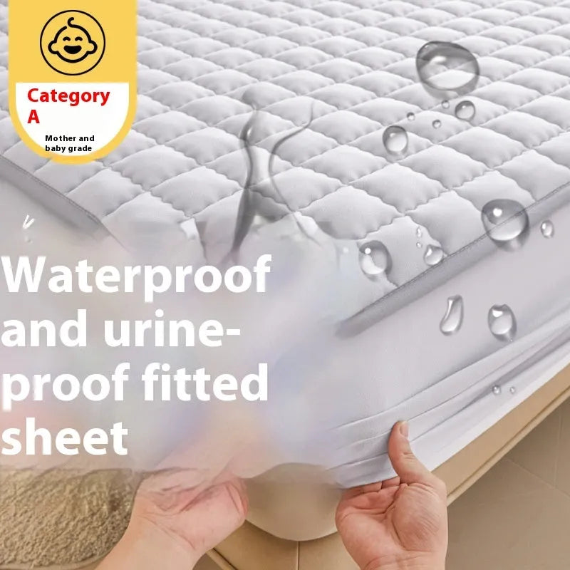 Class A waterproof fitted sheet in light grey colour, shown fitted neatly on a mattress.