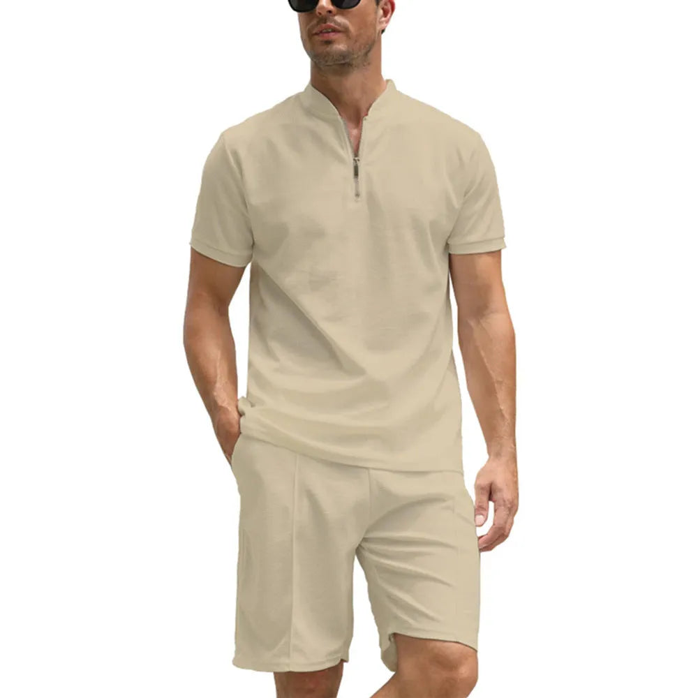 Men's solid colour short sleeve polo shirt and matching trousers two-piece set on a hanger.