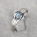 Geometric ellipse women's ring with inlaid zircon stones in Q941 white gold finish