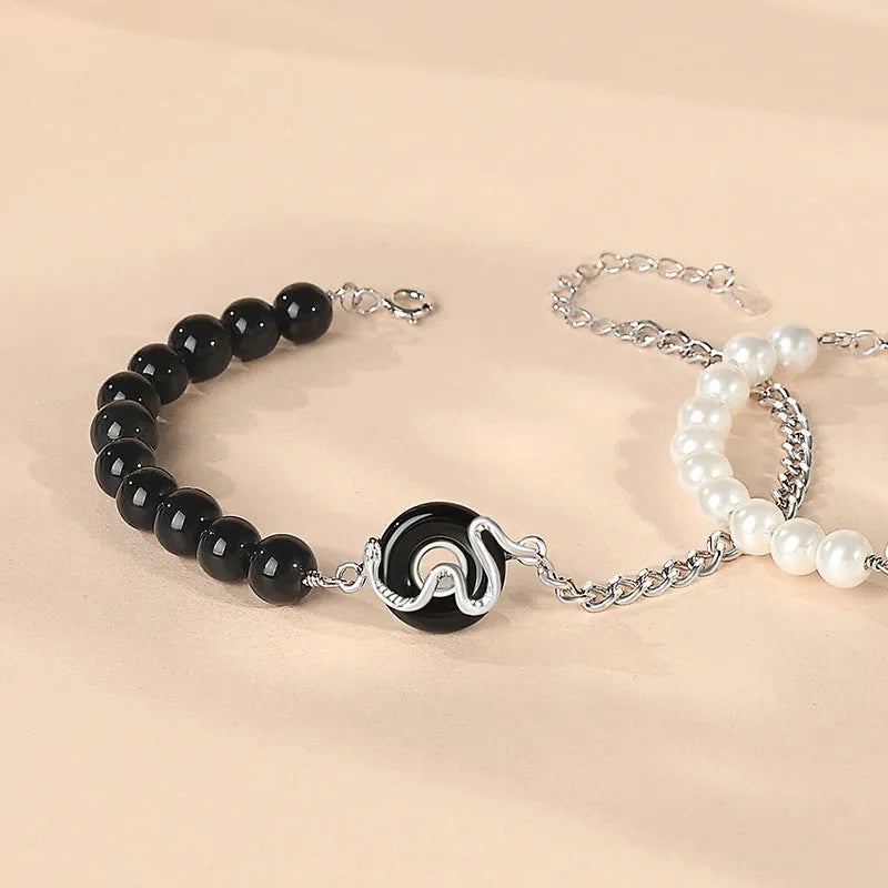 925 sterling silver couple bracelet with snake design and obsidian pearl accents on security buckle