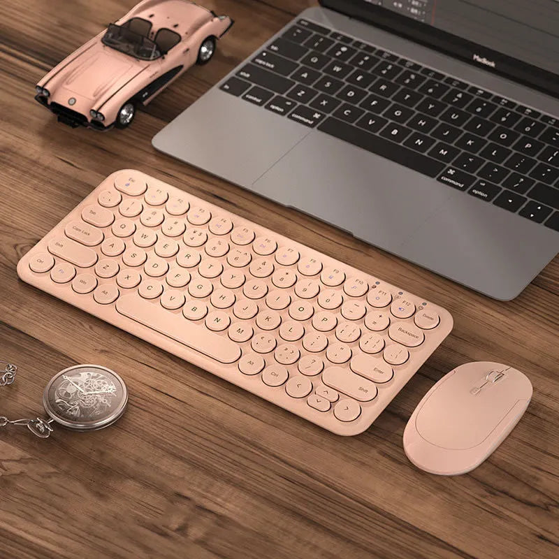 White ultra-thin wireless keyboard and mouse set with USB receiver and keyboard film on desk