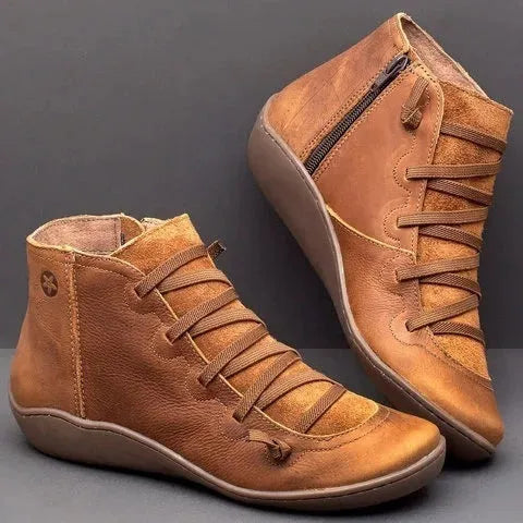 Women's flat casual booties with wedge heel and round toe in multiple colour options.