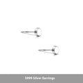 A pair of simple, round, flat-fronted S999 sterling silver ear bone studs on a plain background.