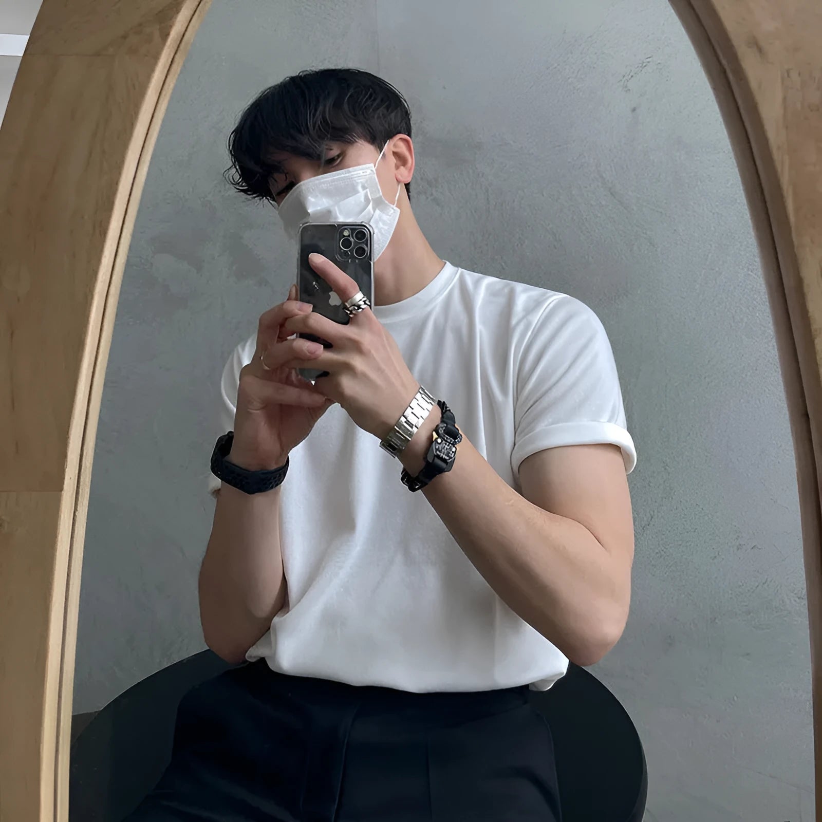 A man's slim-fit cotton T-shirt in solid white, showing the regular half-length sleeves and round neck.