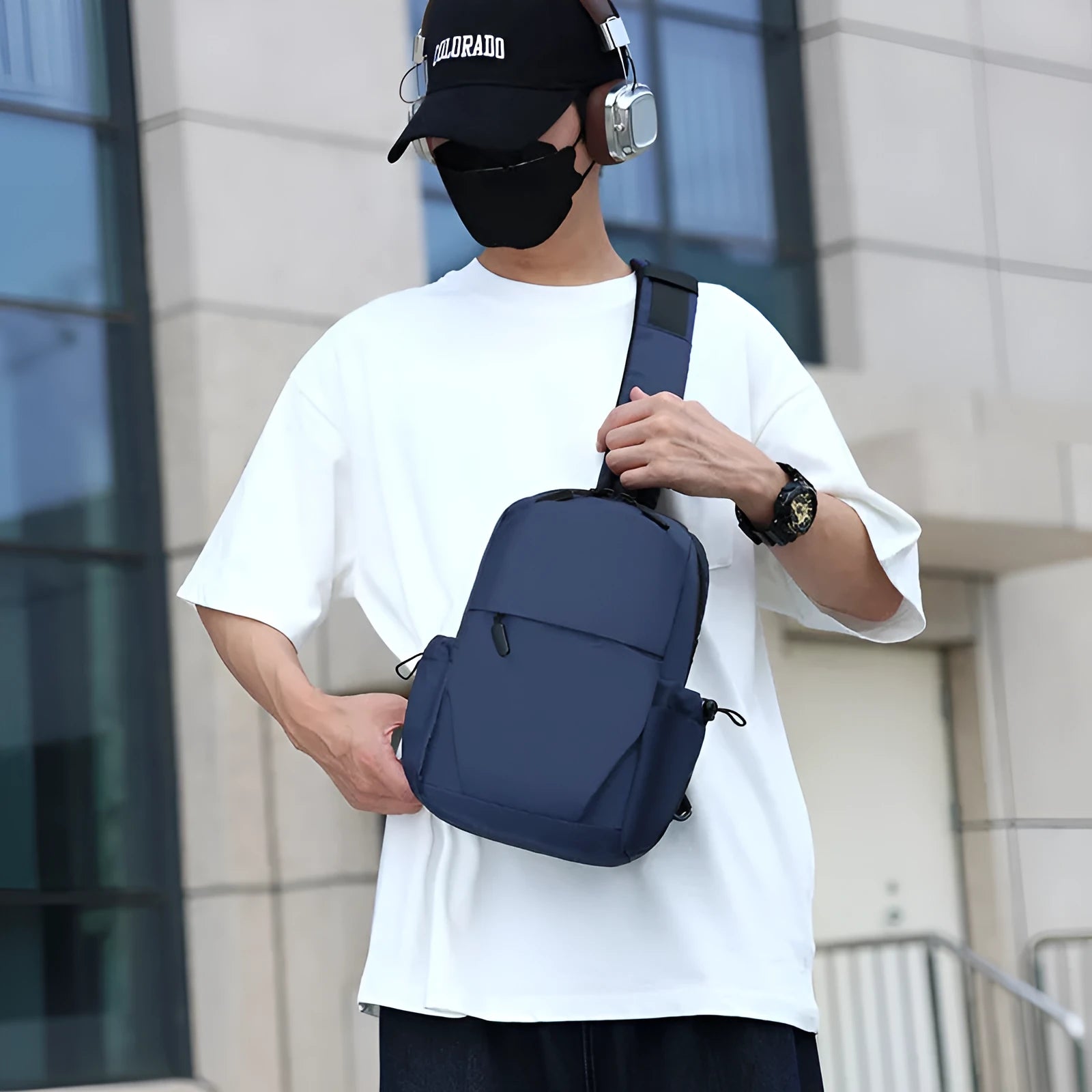 Men's grey lightweight chest bag with large main compartment and shoulder strap.
