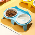 Ceramic cat food and water bowl set on elevated tilted ABS plastic stand in blue colour
