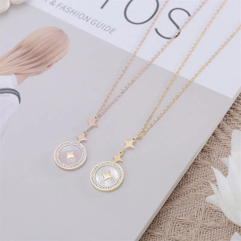 Gold six-pointed star titanium steel necklace on a model, showing the geometric pendant and O-ring chain.