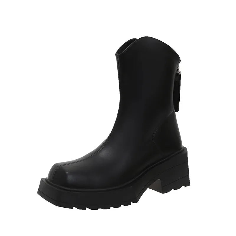 Women's black platform Martin boots with square toe, chunky heel, and back zipper on a white background.