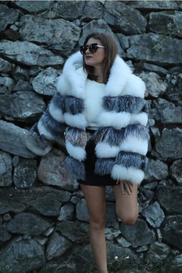 Women's loose brown artificial fur hooded coat on a hanger, street fashion style.