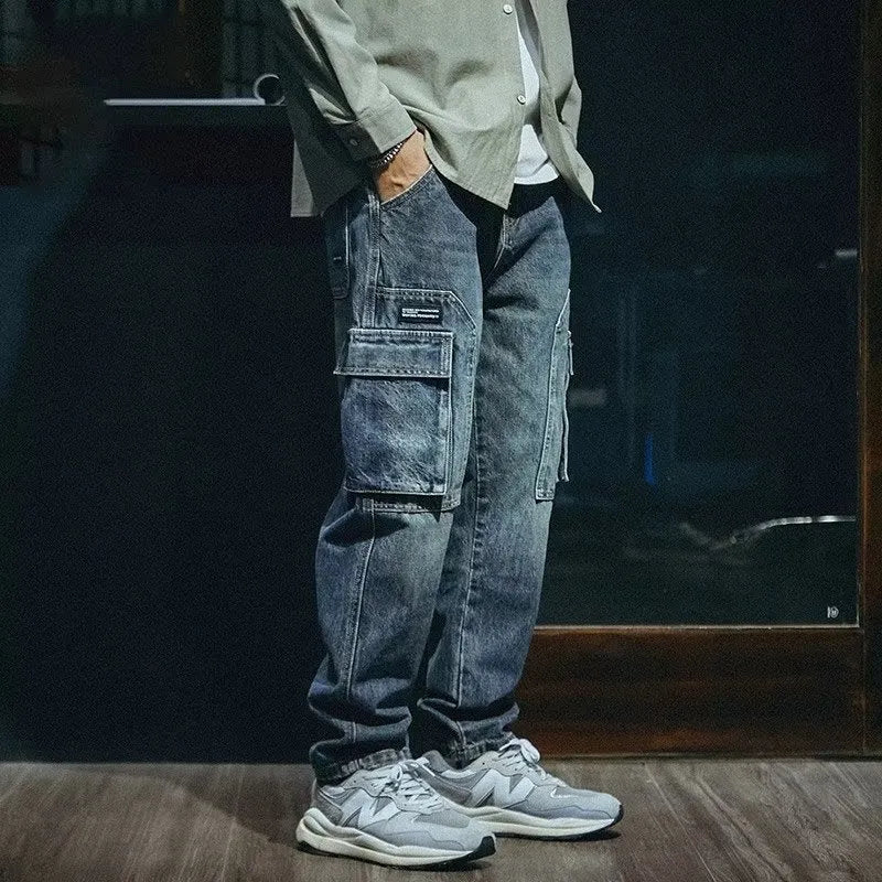 Blue men's loose straight-leg retro stretch denim trousers on a white background.