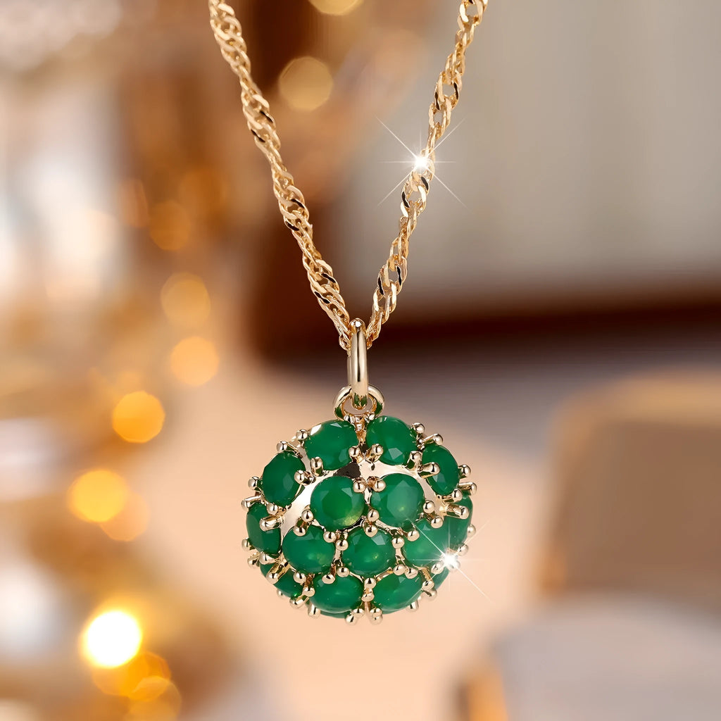 Round emerald and diamond necklace with champagne gold finish and adjustable chain