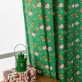 Green Christmas curtain with printed snowman and angel cartoon figures for window decoration