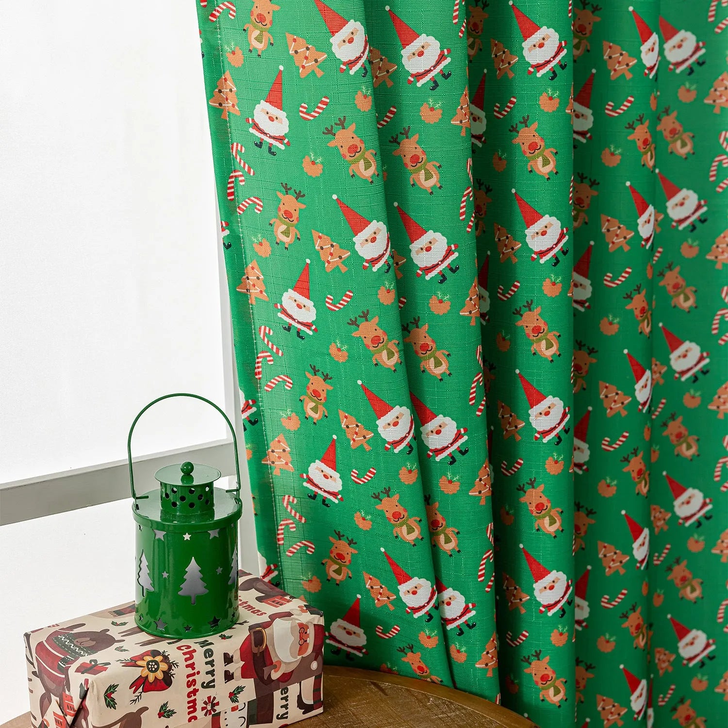Green Christmas curtain with printed snowman and angel cartoon figures for window decoration