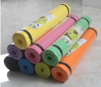 Red EVA yoga mat with textured anti-skid surface, shown rolled and unrolled.