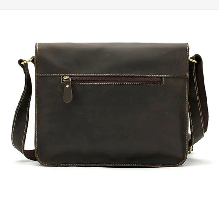 Brown leather vintage messenger bag with adjustable strap and buckle closure