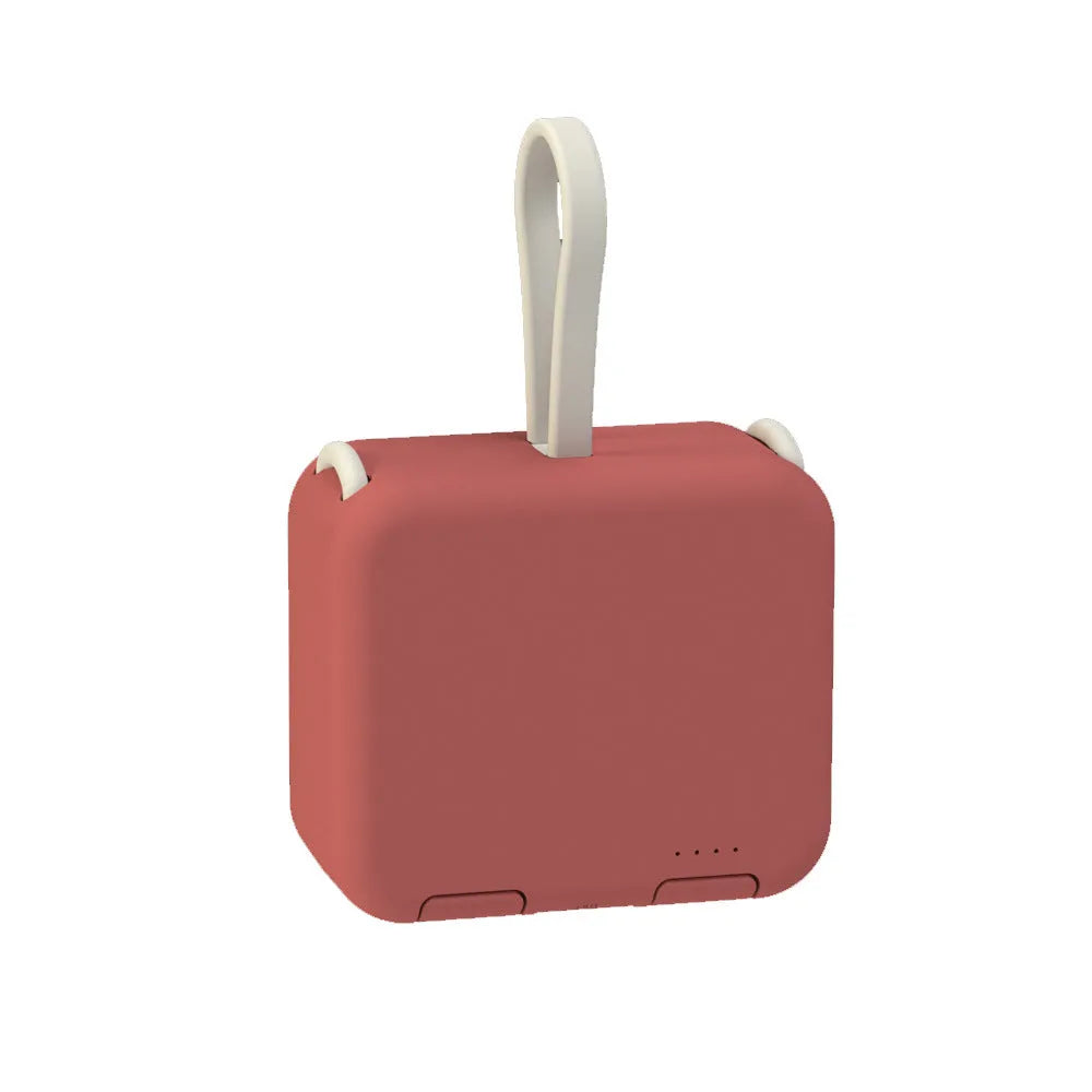 Handbag clip power bank in blue showing phone stand function with charging ports visible