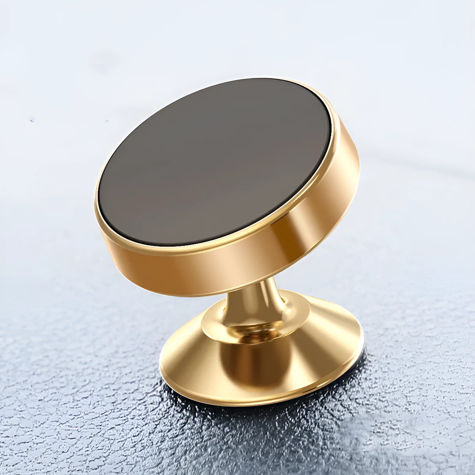 Magnetic car phone holder with aluminium alloy cradle shown in black, mounted on a car air vent.