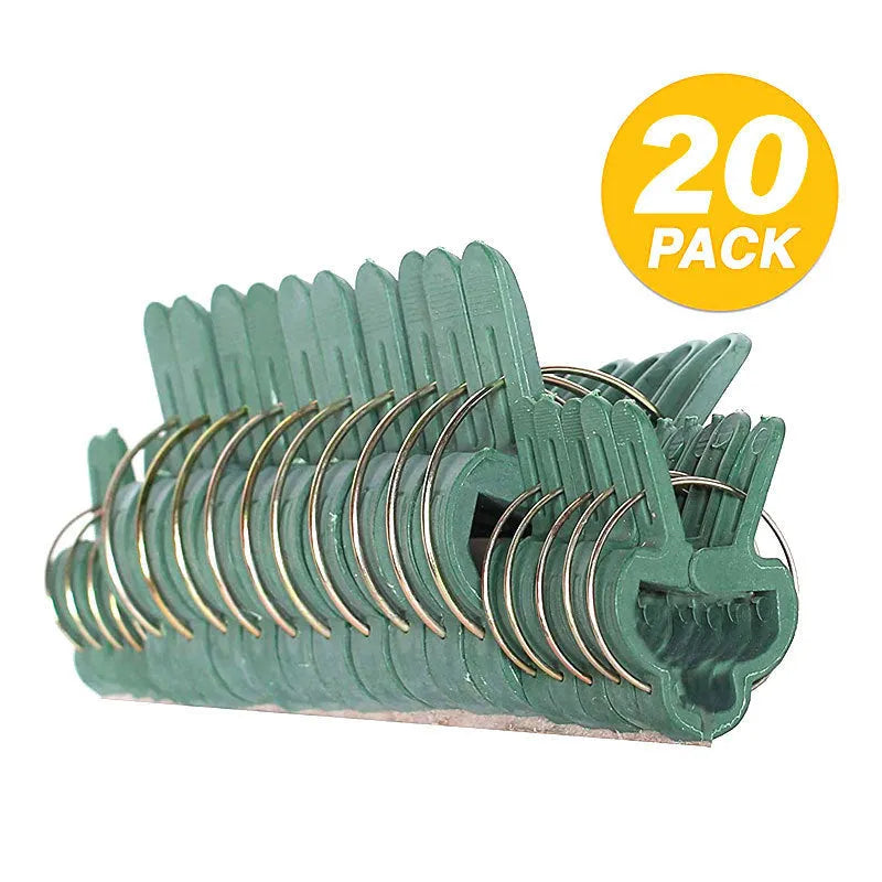 Green plastic and zinc plant fixing clips for large and small climbing plants like tomatoes and beans.