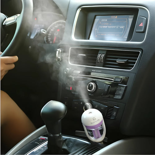 Compact blue car humidifier with 180-degree rotation for vehicle air freshening and humidification