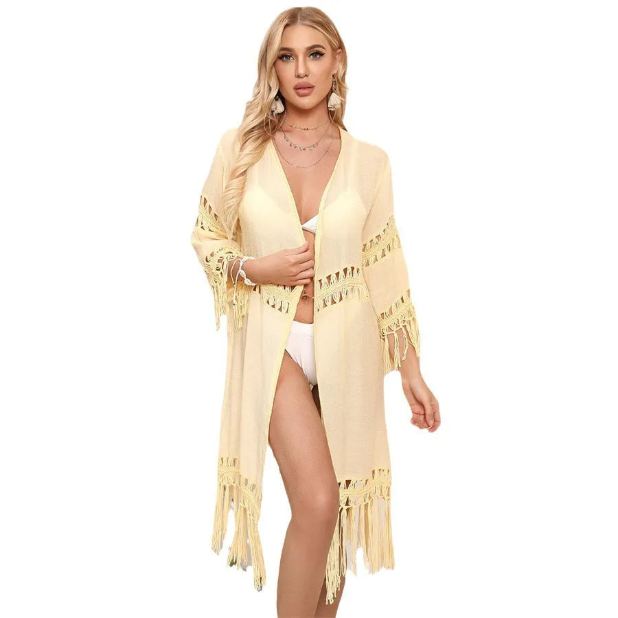 Women's hand-crocheted acrylic beach cover-up cardigan in water green with tassel detail