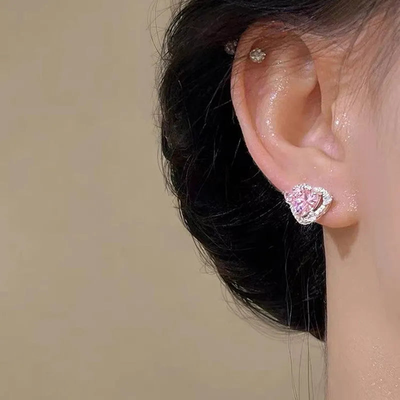 Women's electroplated copper heart stud earrings with white K colour finish and butterfly clutch fastenings