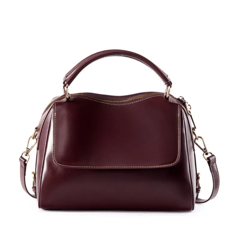 Genuine leather crossbody tote bag in a cross square shape with double straps and internal organiser pockets.