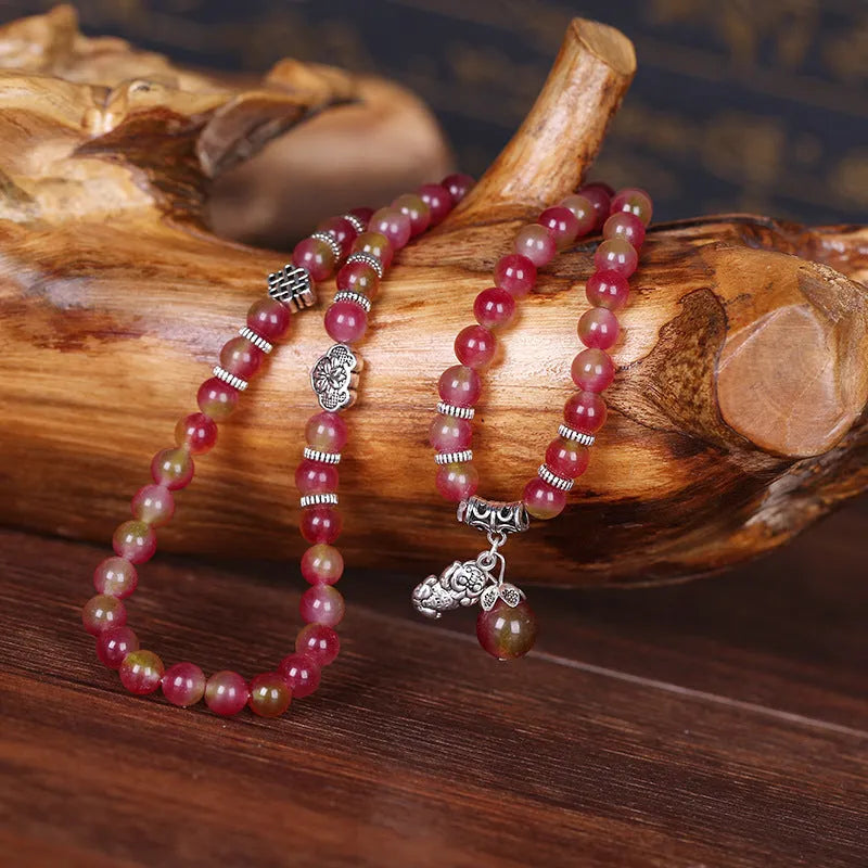 Watermelon crystal bracelet with Chinese knot detailing in geometric national style design