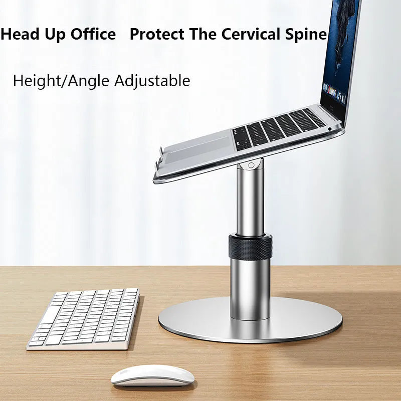 Aluminium car laptop stand in silver, showing adjustable height and rotating base with non-slip silicone pads.