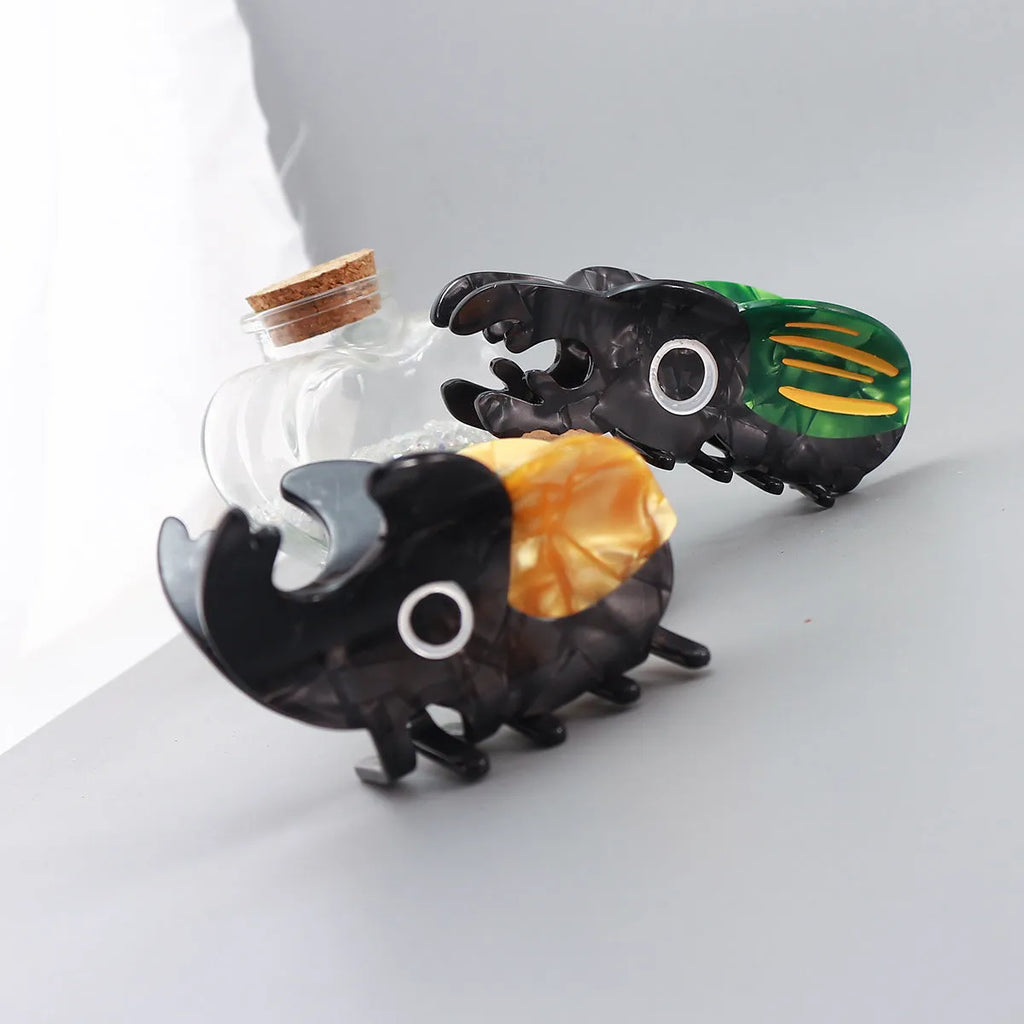Handmade cellulose acetate insect biology beetle grip in green beetle design