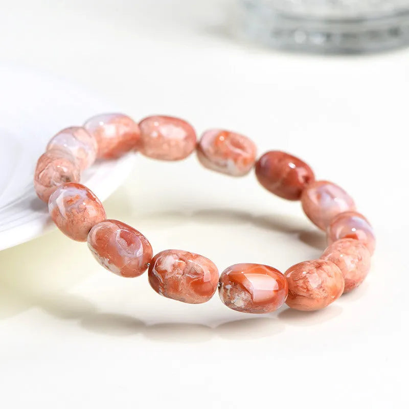 Natural cherry agate bracelet with barrel-shaped beads and ruyi design elements