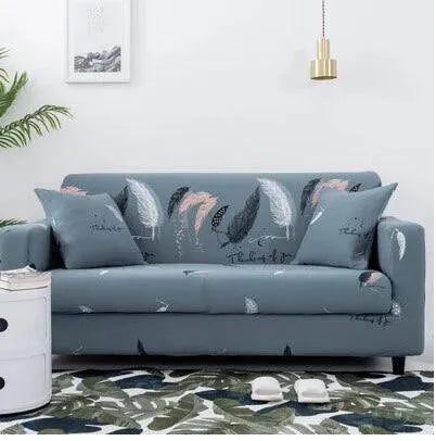 Printed stretch sofa cover with geometric pattern on three-seater sofa