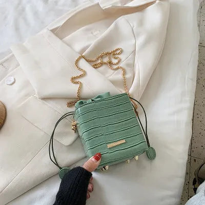 Women's small one shoulder messenger bag with chain strap in bucket style design