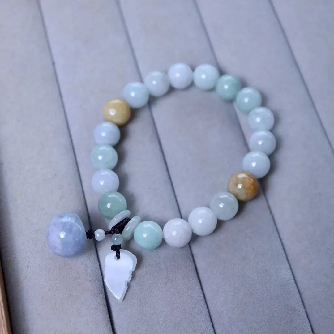 Natural jade geometric bracelet with hanging charm showing Apple design option