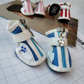 Set of four pairs of blue cloth dog sneakers with a side zipper for small breeds.