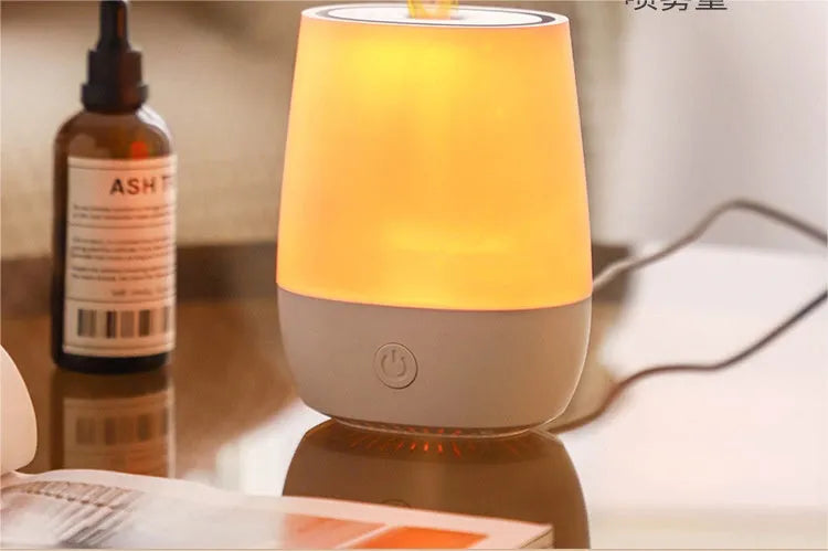 White USB aroma diffuser with simulated flame effect on wooden surface