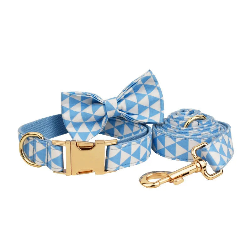 Blue cloth dog accessory set showing vest, collar, leash, and bow for small to medium breeds