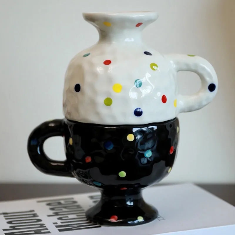 Hand-pinched irregular ceramic mug in a solid colour, showing unique handmade shape.