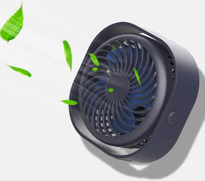 USB desk fan with rotating head in modern alarm clock style on a desk.