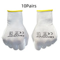 White PU coated labour gloves showing textured palm grip, medium and large sizes on a workbench.