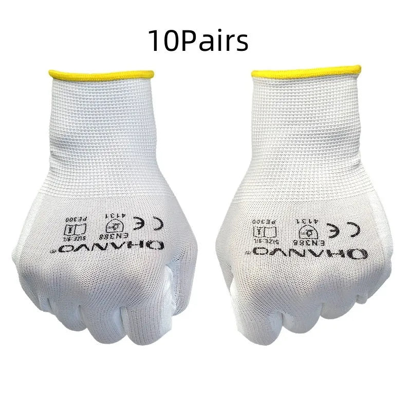 White PU coated labour gloves showing textured palm grip, medium and large sizes on a workbench.