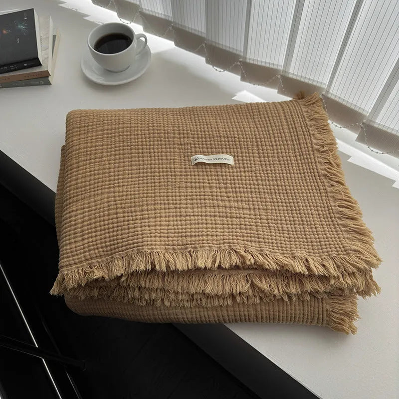 Four-layer gauze cotton blanket with knotted tassels in avocado green colour