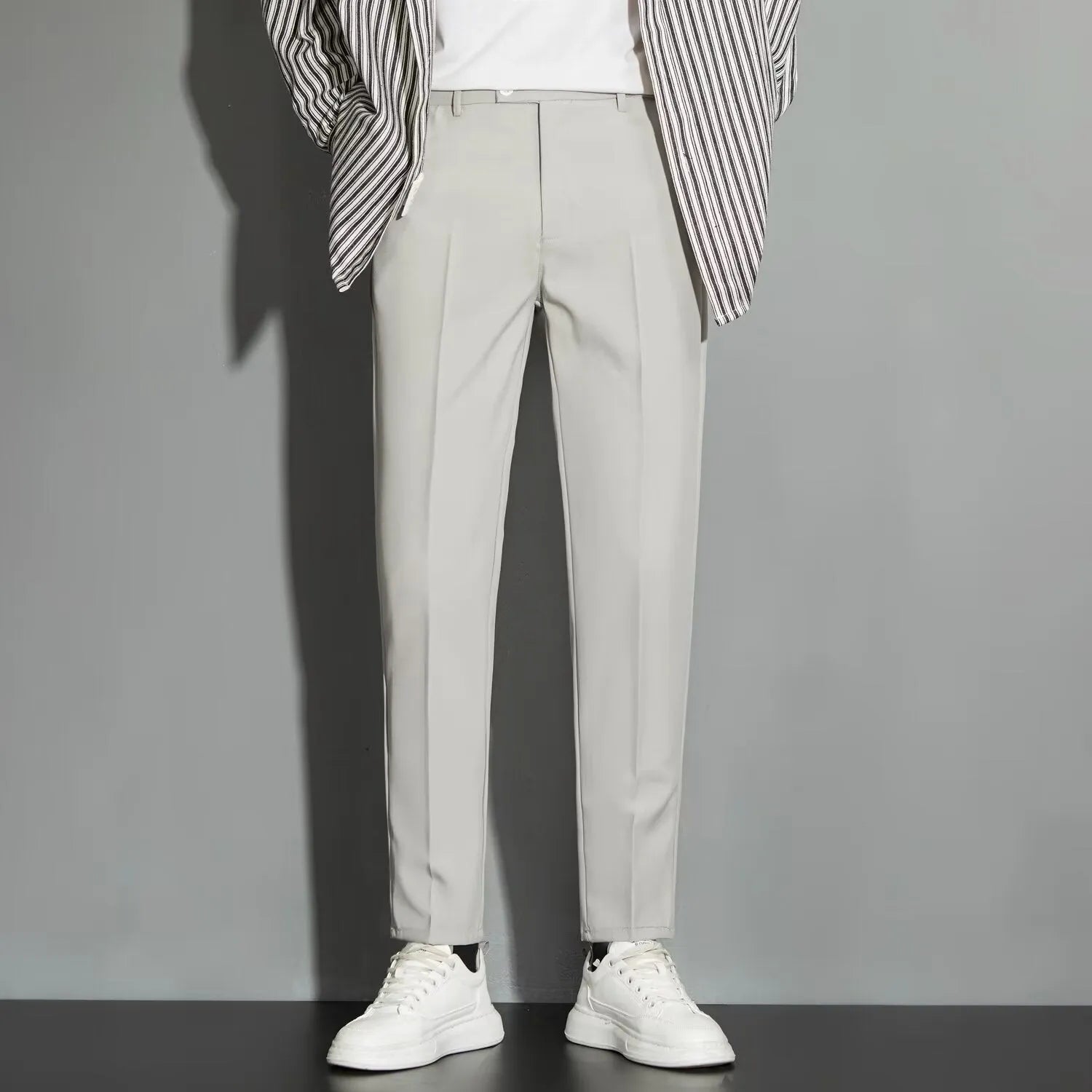 Men's straight ankle-length suit trousers with spring draping effect in chemical fibre blend fabric
