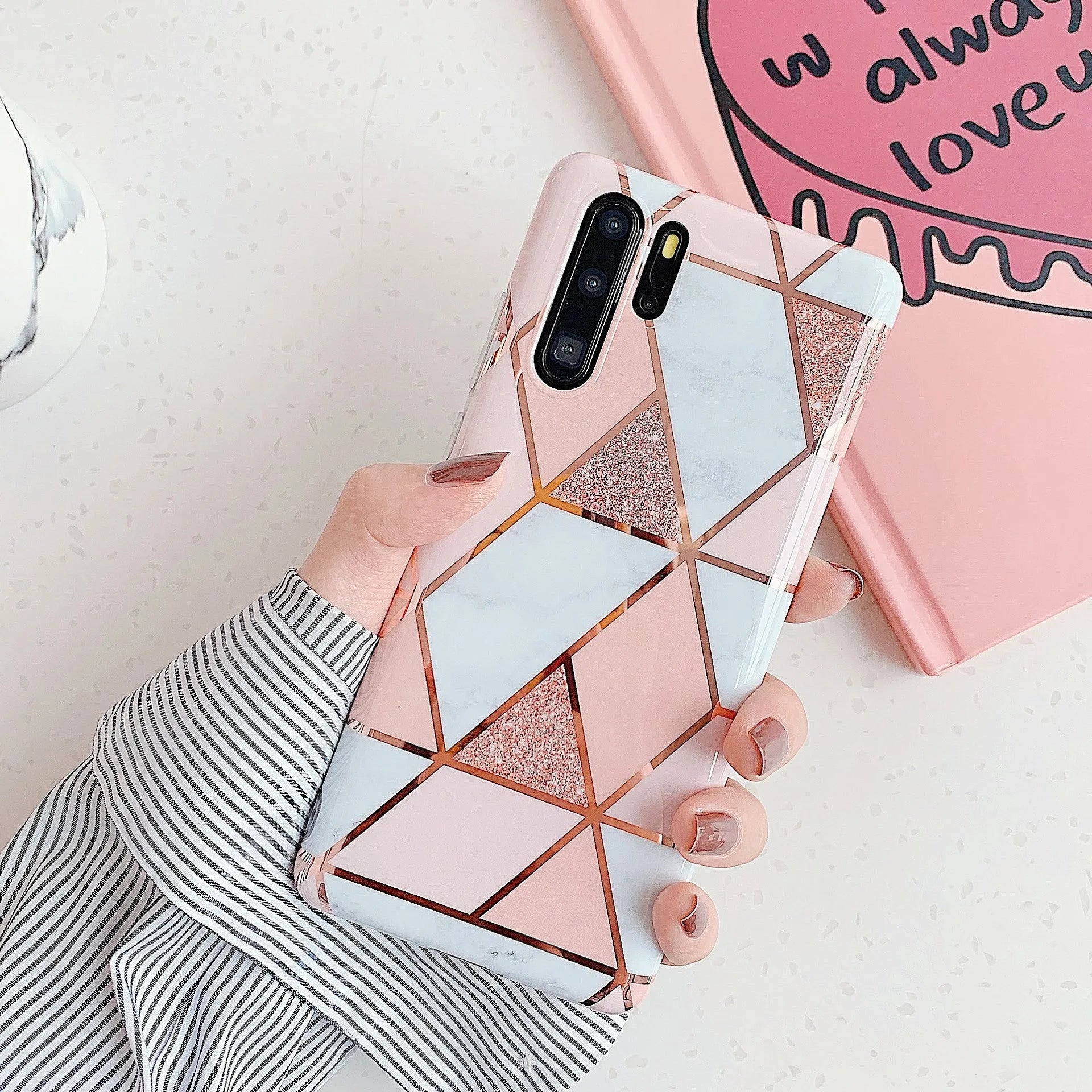 Glossy electroplated marble design TPU back cover case for a Huawei smartphone.