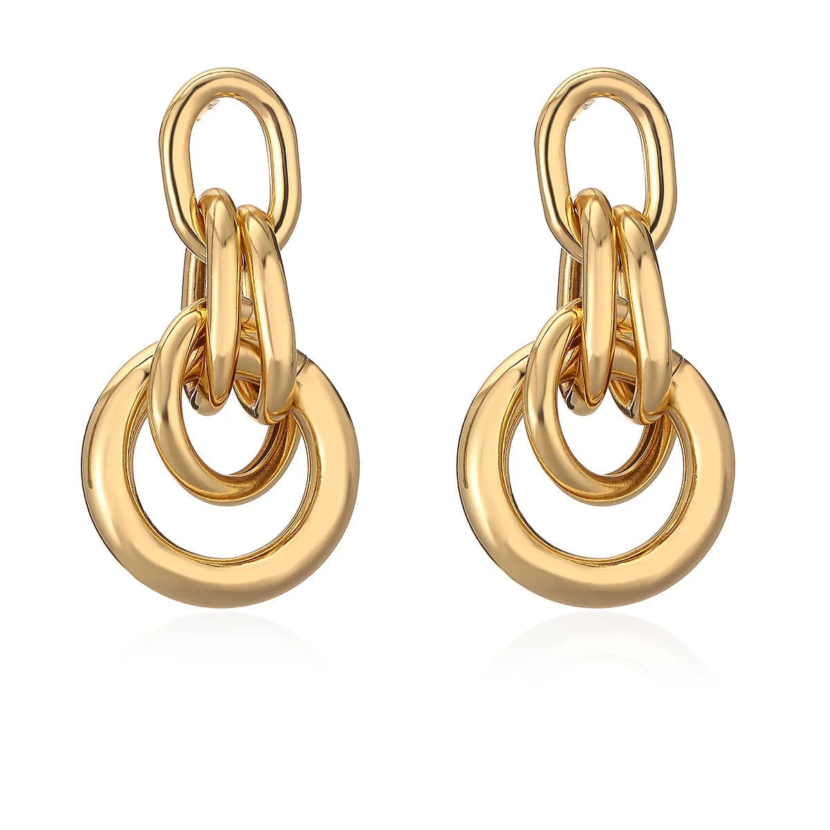 A pair of gold-toned geometric drop earrings with an irregular shape, made from copper.