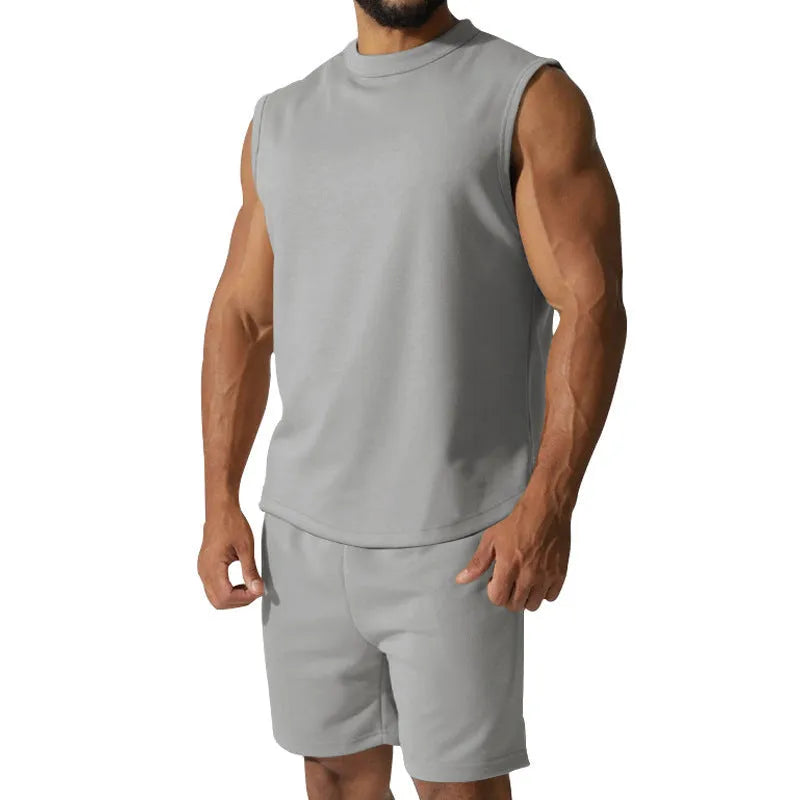 Men's sleeveless cotton blend sports top and matching shorts in a solid colour