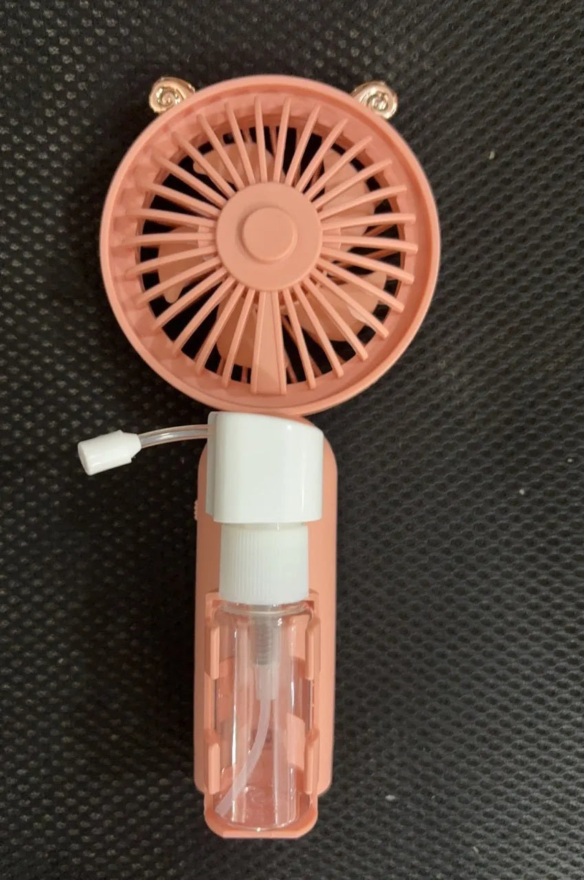 USB-powered personal handheld fan in apricot colour with plastic nozzle