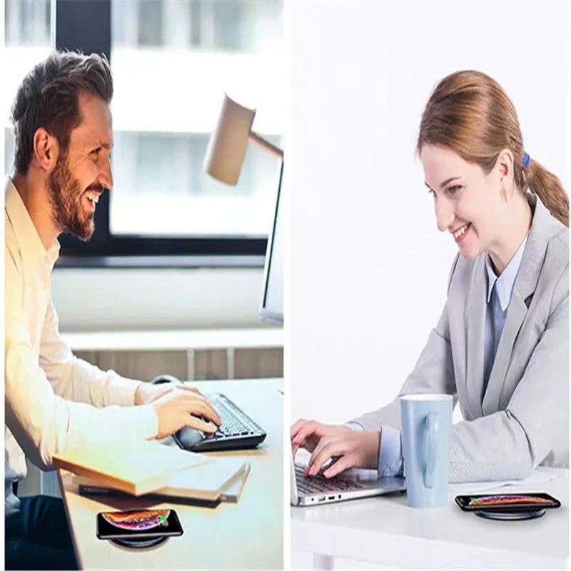 Black 15W fast wireless charging pad with LED indicator light on a desk