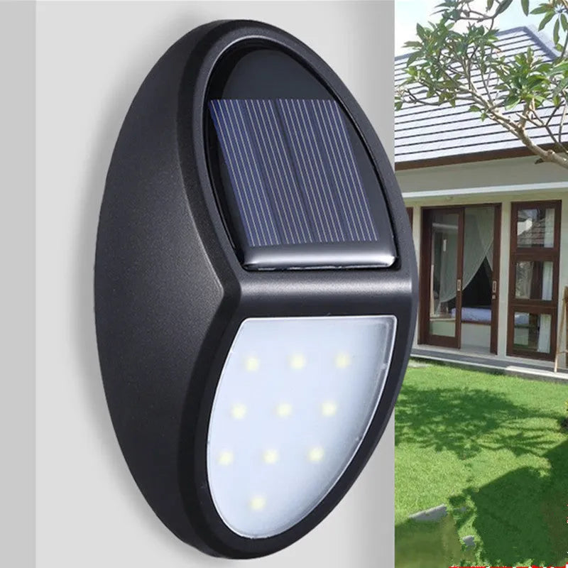 Black rectangular LED solar wall light for outdoor garden or security use
